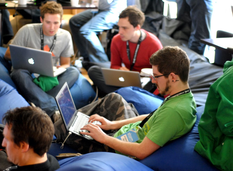 Hackathon attendees on laptops